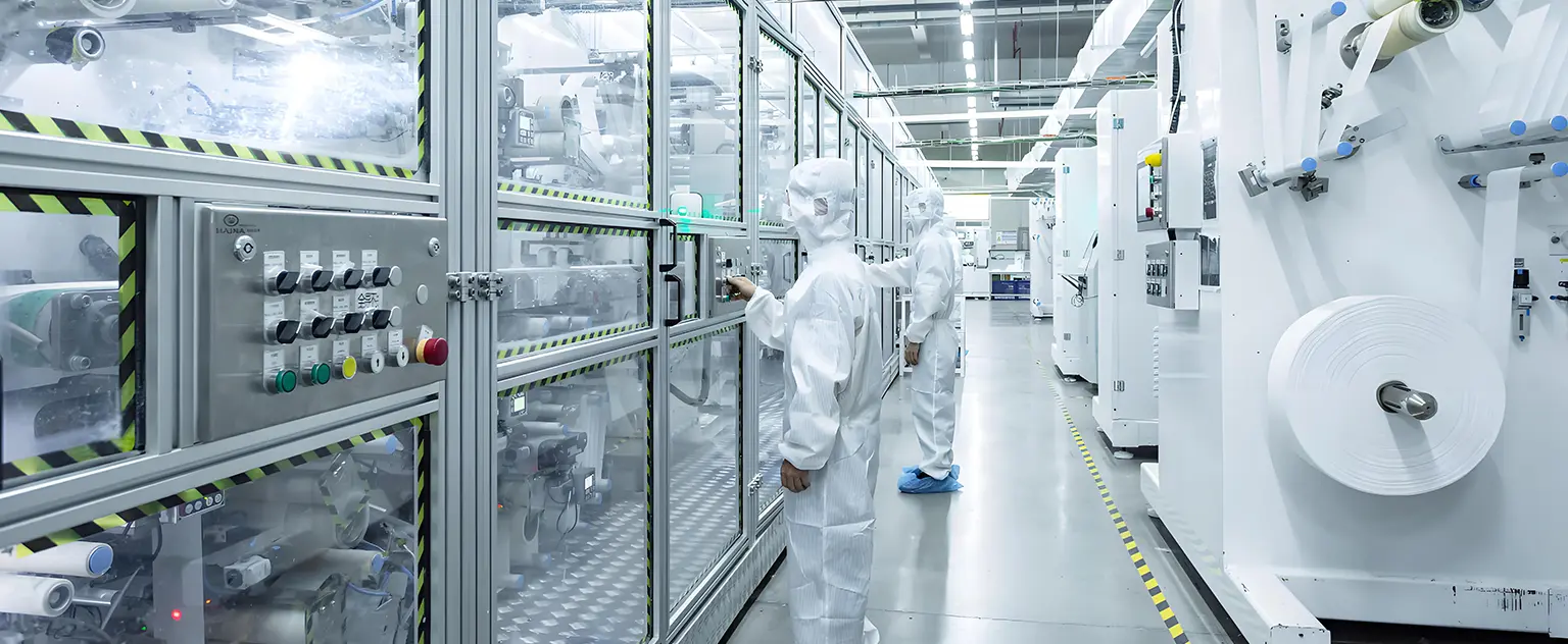 Molyaré manufacturing specialists monitoring sanitary napkin production